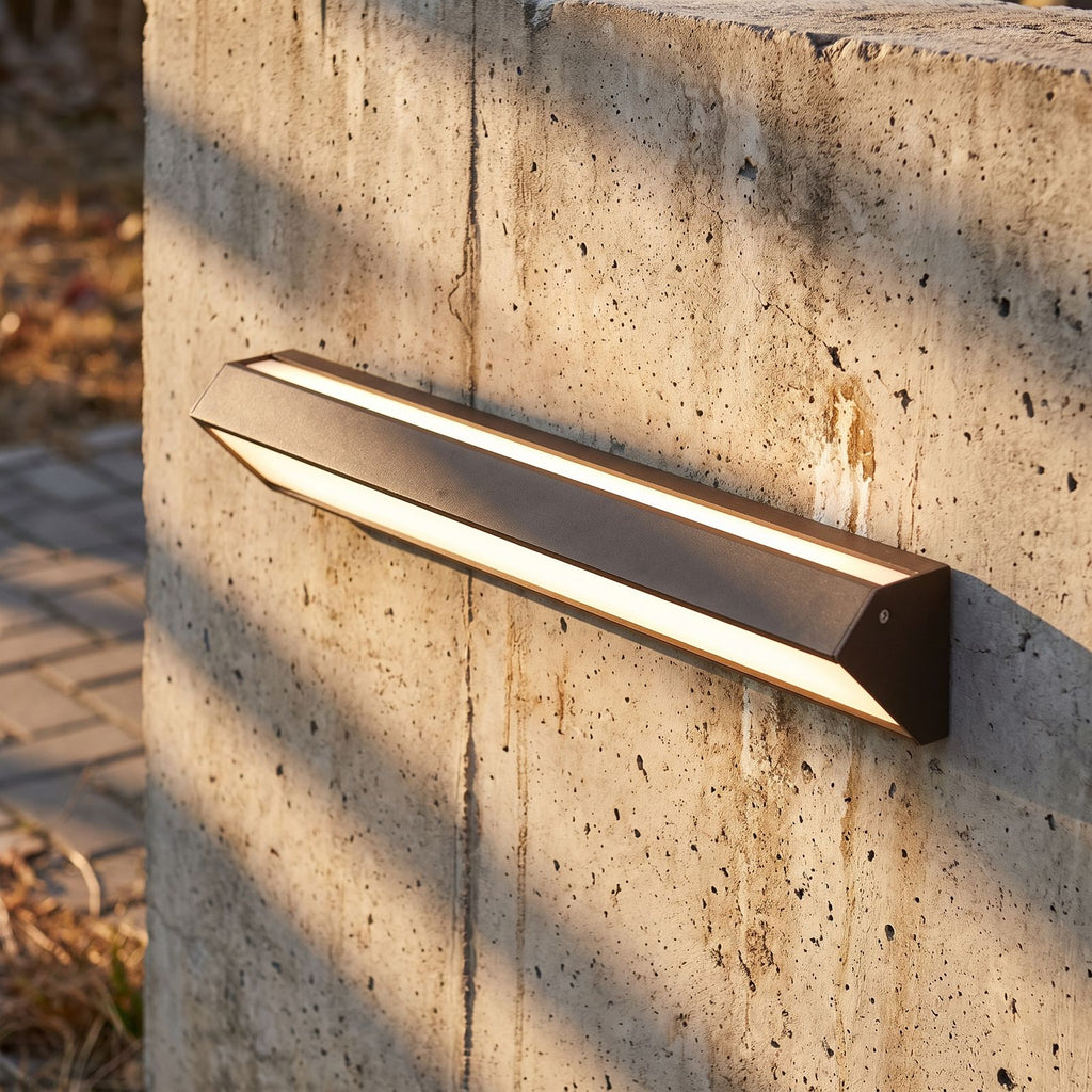 Long Linear Up Down Outdoor Wall Light, close view at 45 degrees on a stone wall