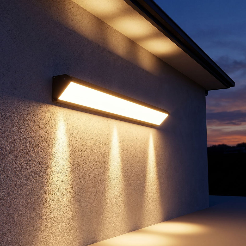 Long Linear Up Down Outdoor Wall Light on a porch wall at dusk