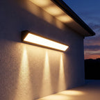 Long Linear Up Down Outdoor Wall Light on a porch wall at dusk
