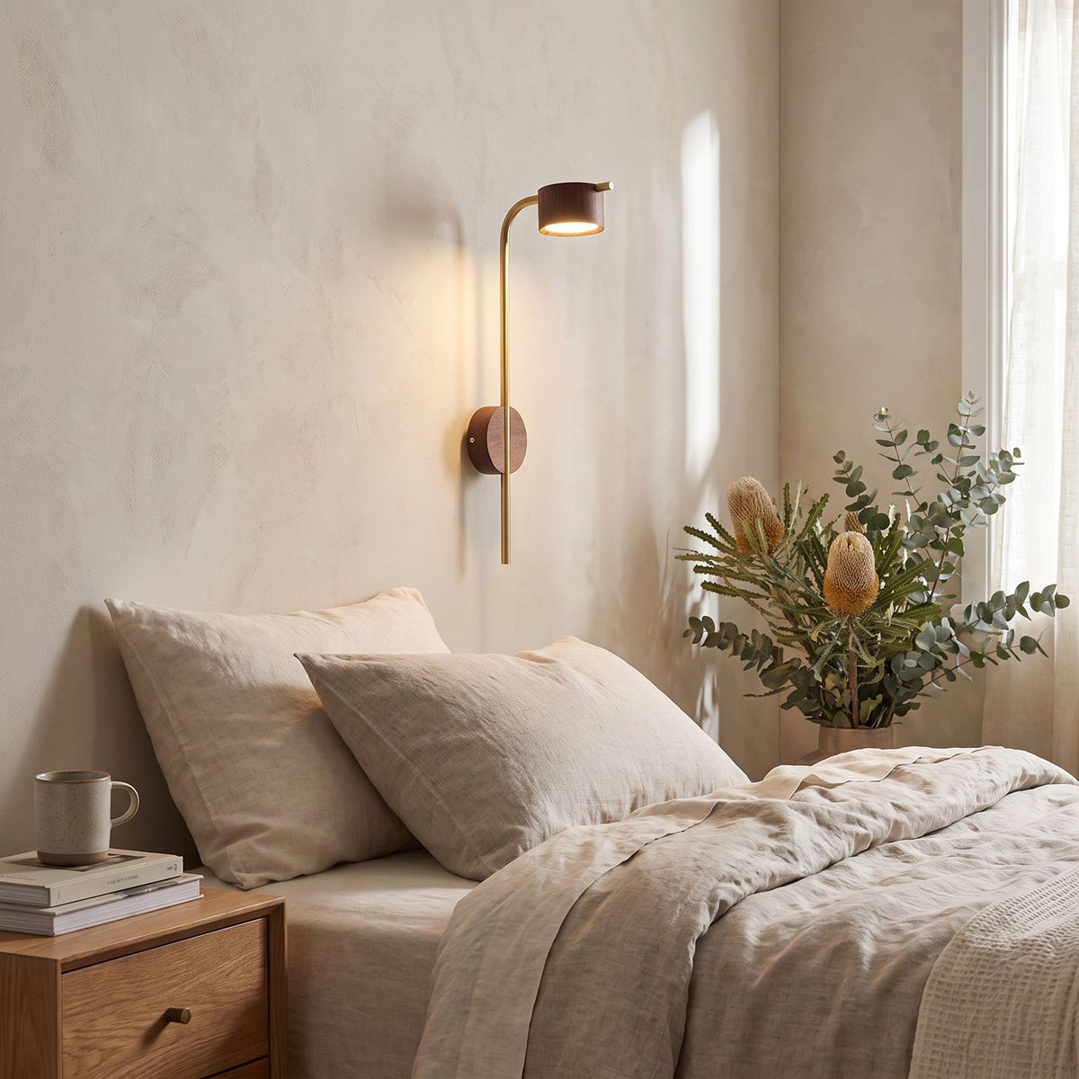 Long Rod Wood Bedside Reading Wall Light on a bedroom wall beside the bed