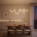 Looped Silicone LED Rope Linear Pendant Light above a dining table