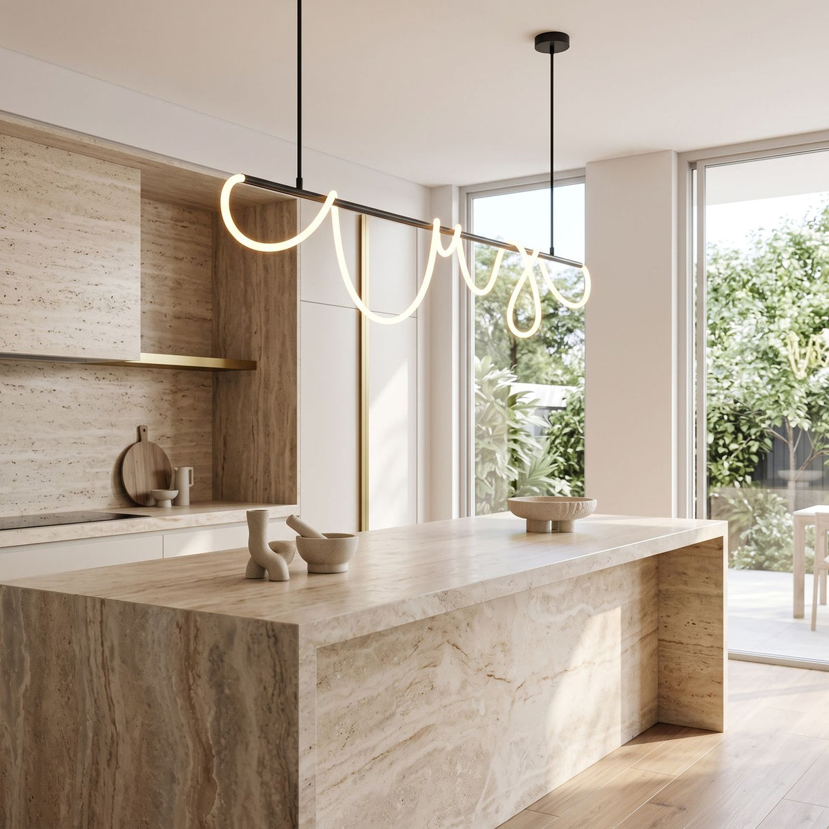 Looped LED rope linear pendant light over a kitchen island in daylight