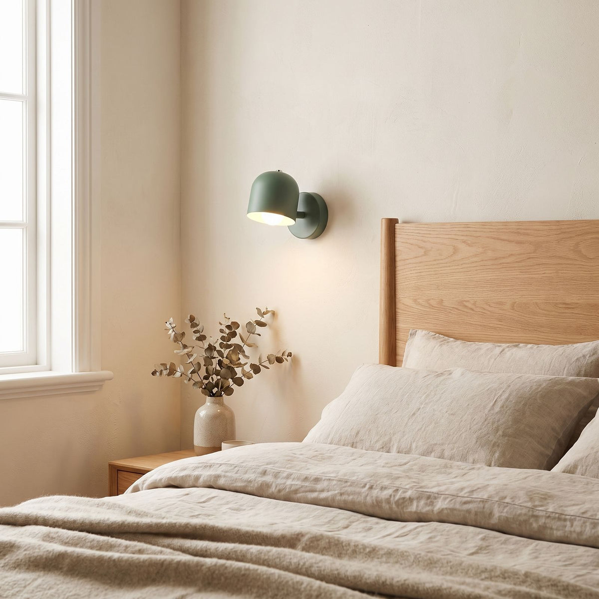 Macaron Glass Flush Wall and Ceiling Light on a bedroom wall beside the bed