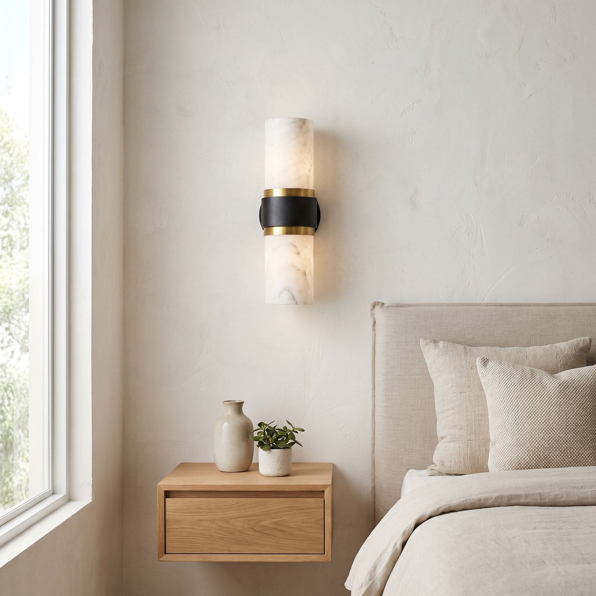 Marble and Cast Iron Up Down Wall Sconce on a bedroom wall beside the bed