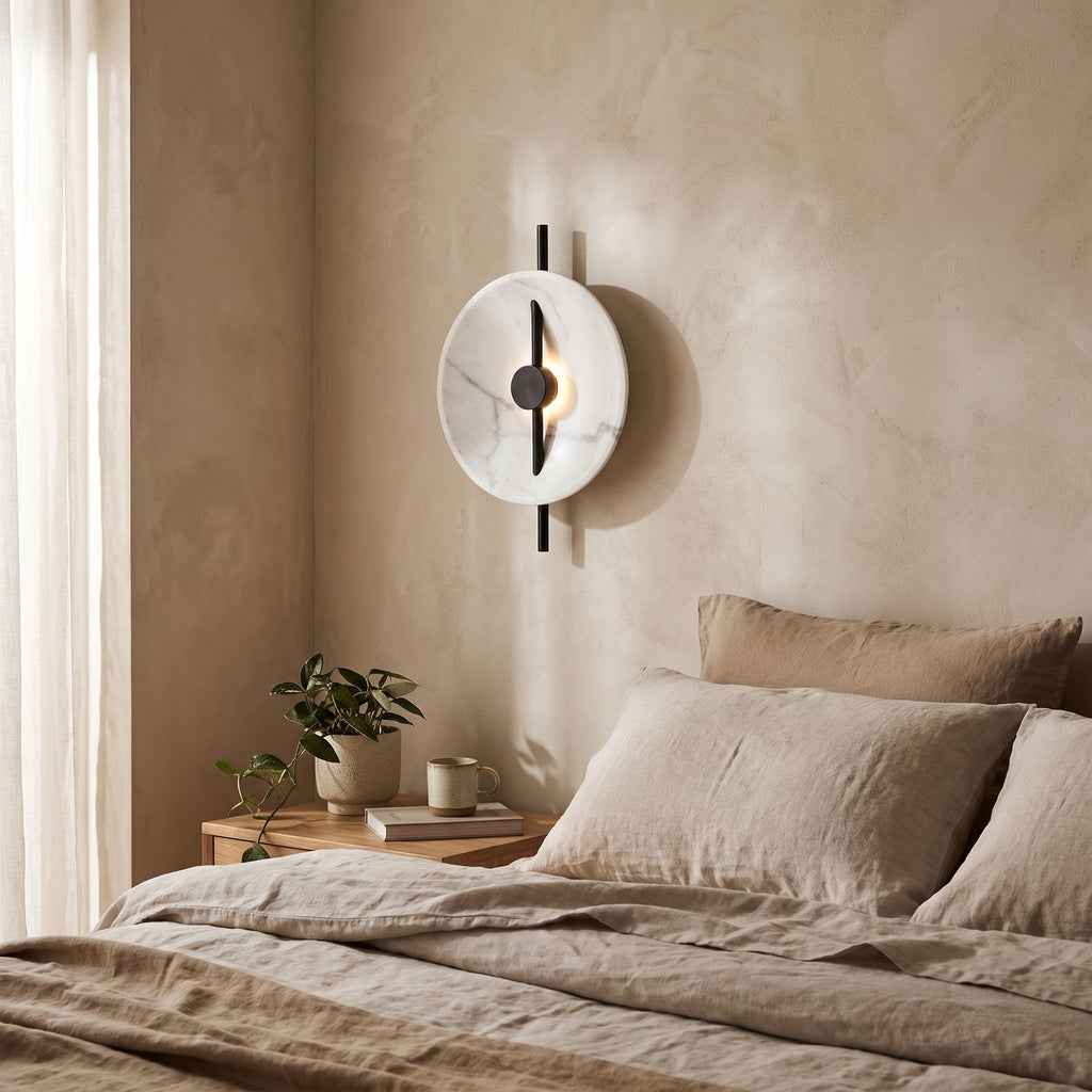 Marble Disc and Black Bar Wall Light on a bedroom wall beside the bed