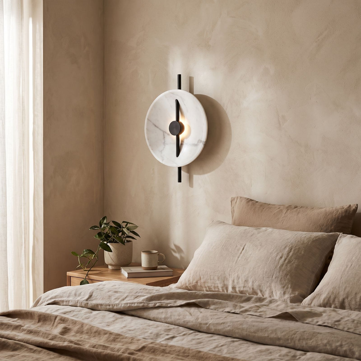Marble Disc and Black Bar Wall Light on a bedroom wall beside the bed