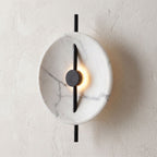 Marble Disc and Black Bar Wall Light, close view at 45 degrees on a plaster wall