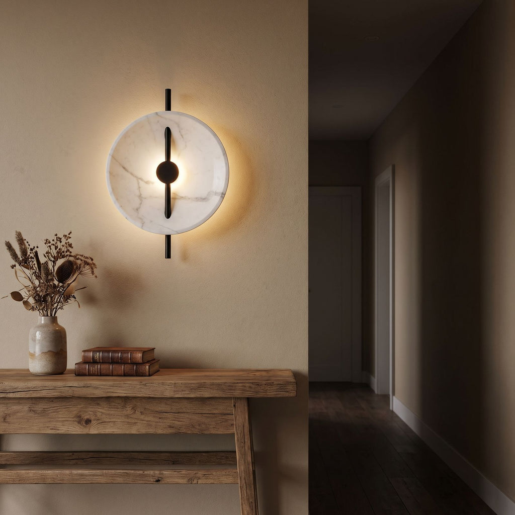 Marble Disc and Black Bar Wall Light in a hallway above a timber console