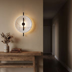 Marble Disc and Black Bar Wall Light in a hallway above a timber console