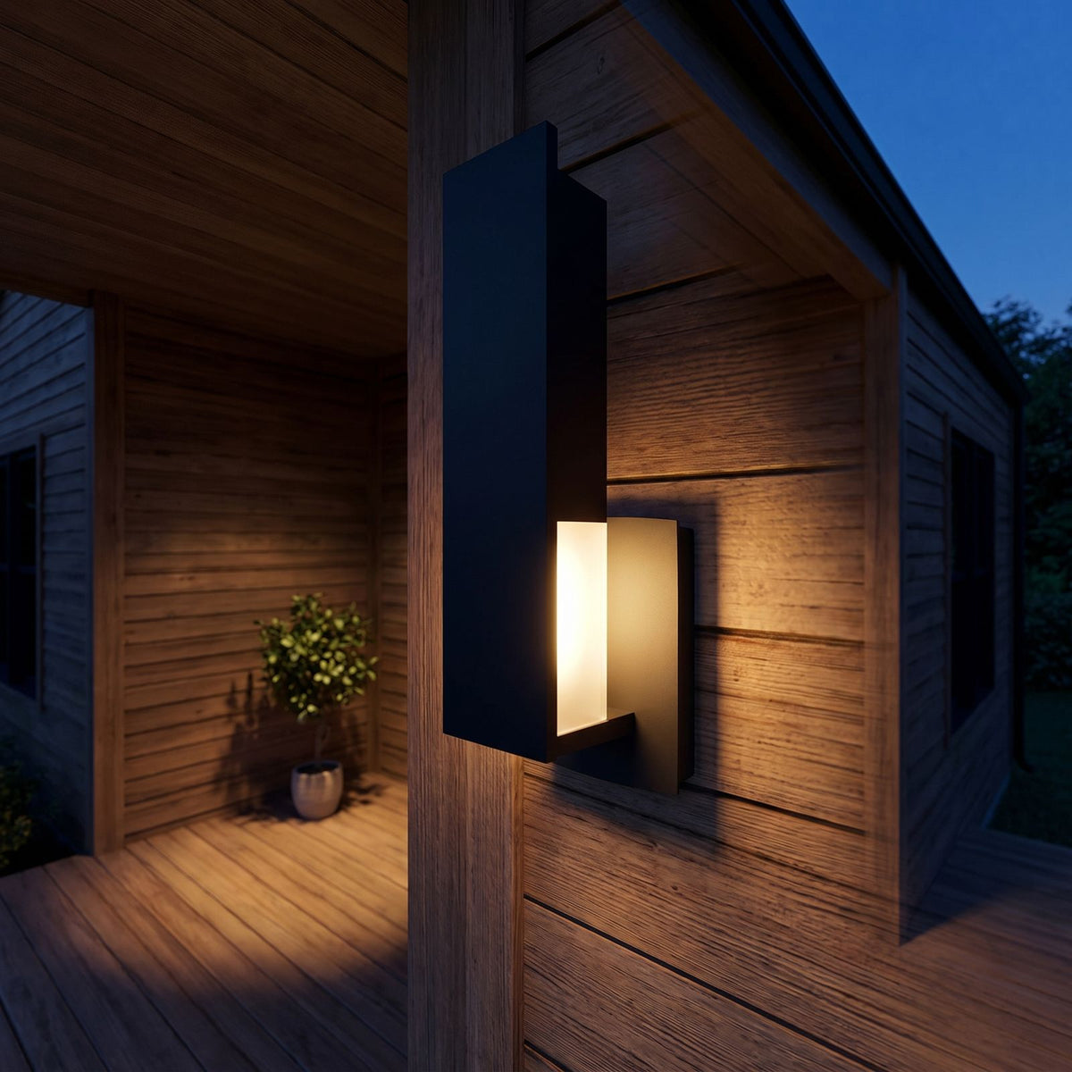 Matte Black Aluminium Lantern Outdoor Wall Light on a porch wall at dusk