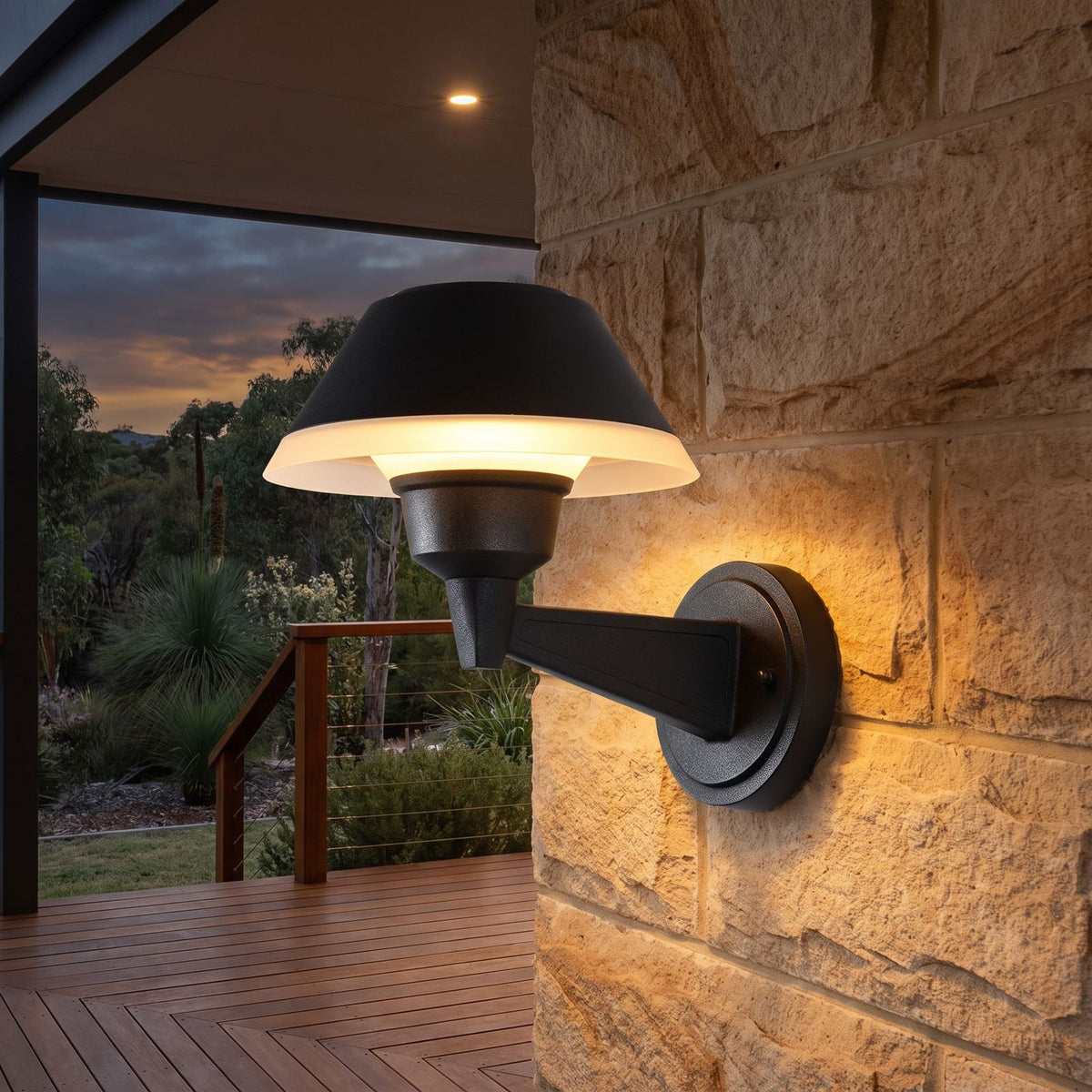Matte Black Bowl Outdoor Wall Light on a porch wall at dusk
