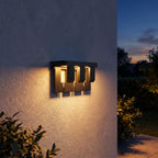 Matte Black Metal Outdoor Wall Light on a porch wall at dusk