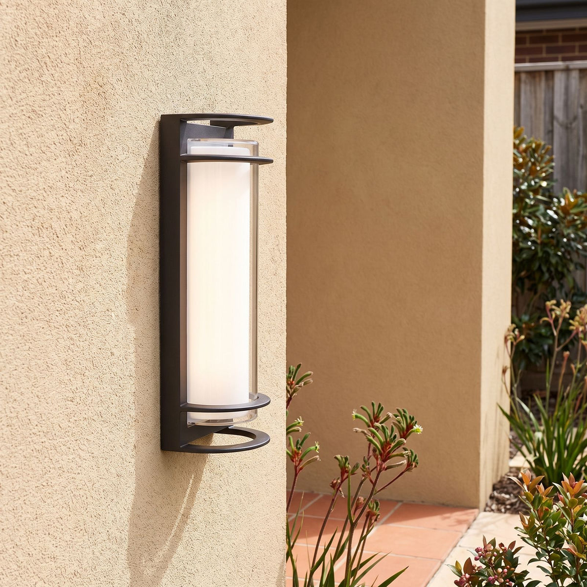 Metal and Acrylic Courtyard Outdoor Wall Light beside a timber front door