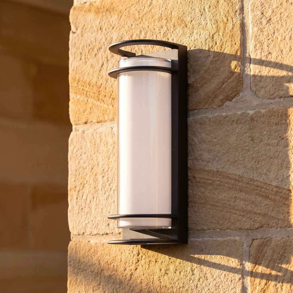 Metal and Acrylic Courtyard Outdoor Wall Light, close view at 45 degrees on a stone wall