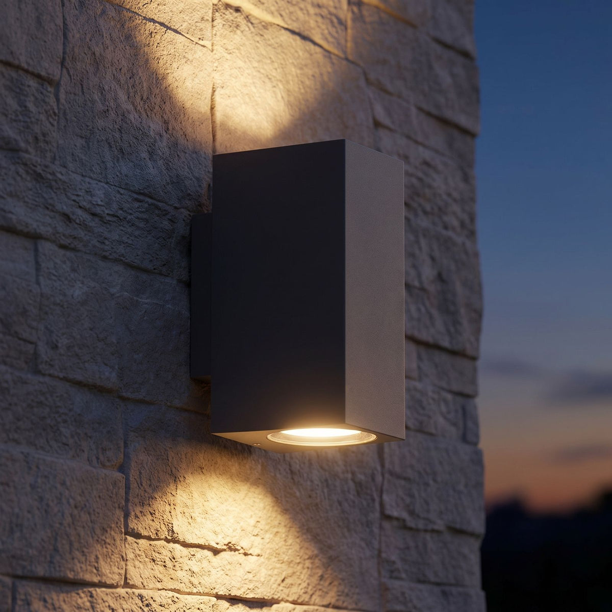 Metal and Glass GU10 Outdoor Wall Light on a porch wall at dusk