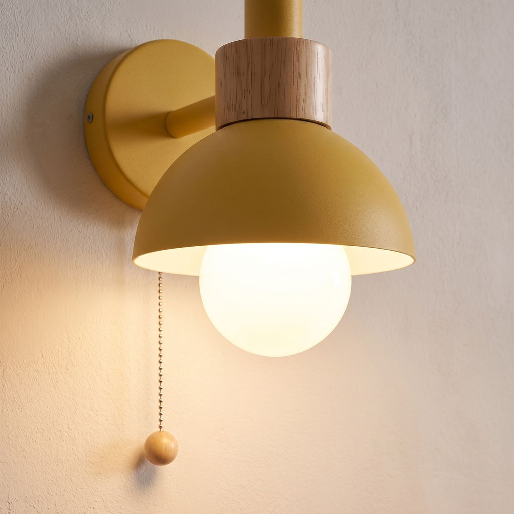 Close-up of the yellow dome, wood collar and pull chain