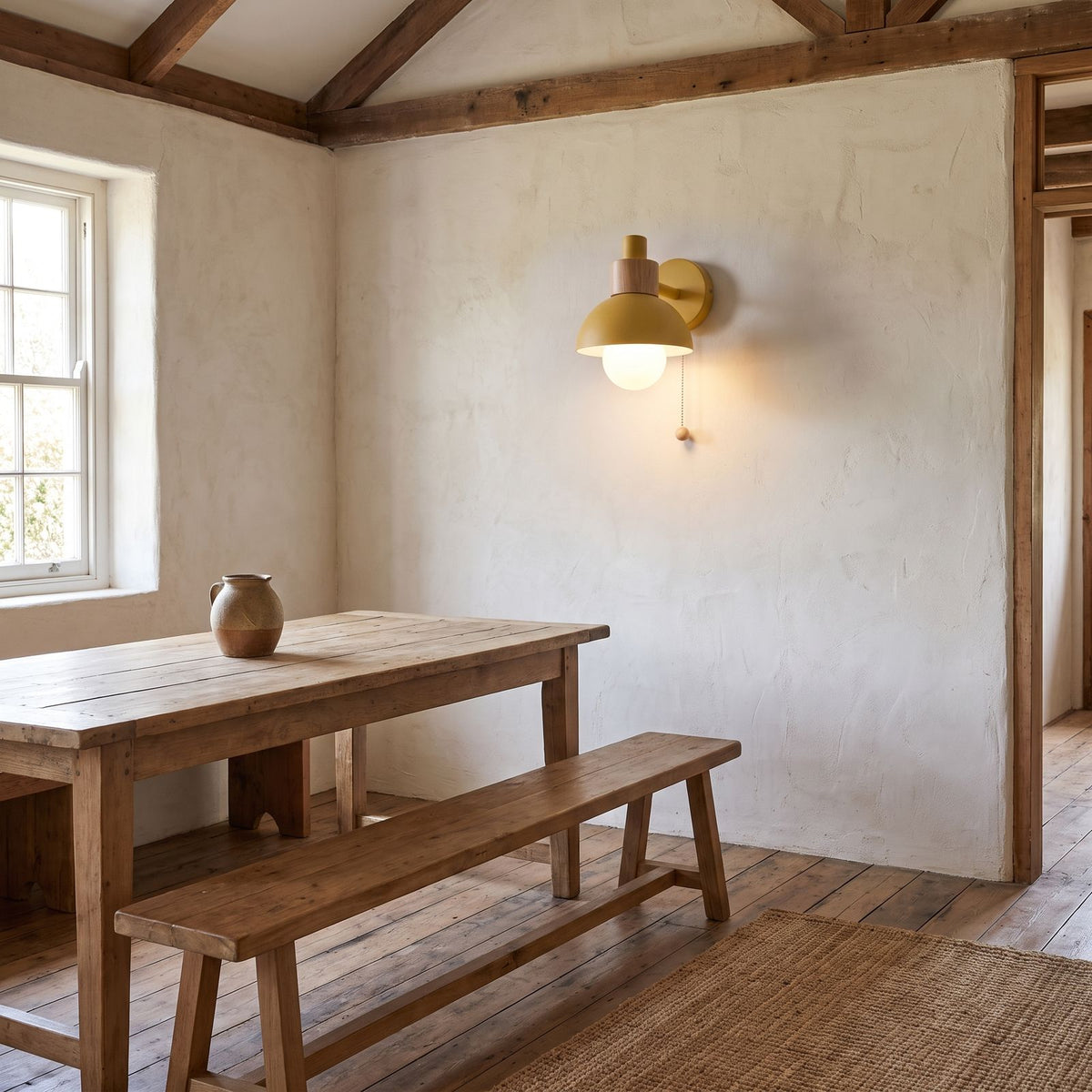 Metal Dome and Wood Collar Pull Chain Wall Light on a dining room wall
