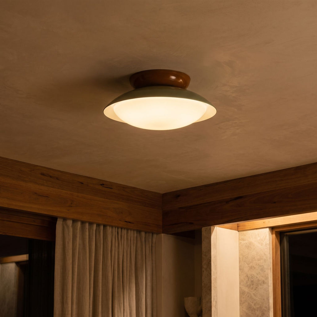 Mid-Century Metal Dome LED Ceiling Light glowing on a ceiling at night