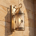 Middle Eastern Style Brass Lantern Outdoor Wall Light, close view at 45 degrees on a stone wall