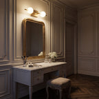 Milky Glass Globe Bar LED Vanity Wall Light above the mirror of a makeup table at night
