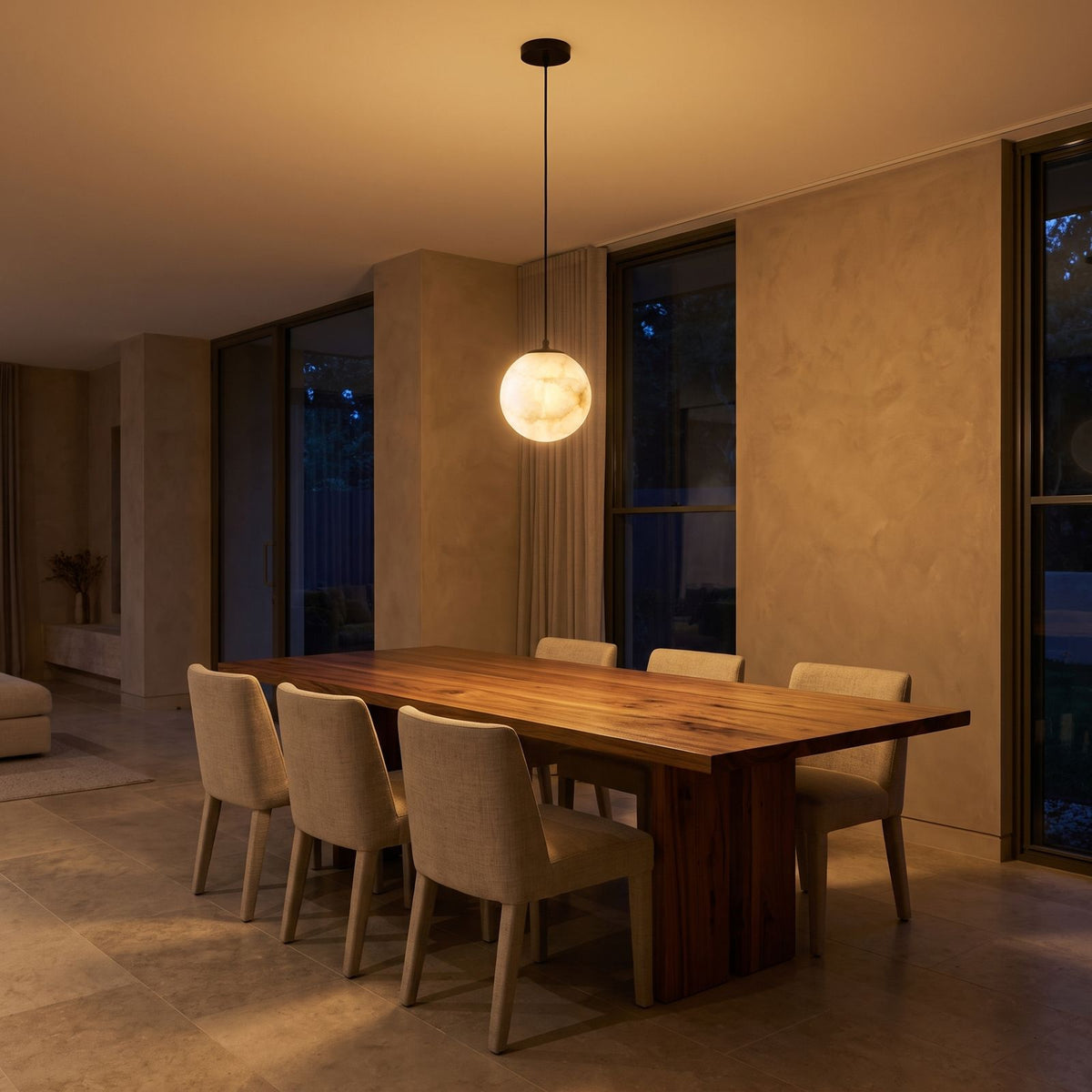 Mini Alabaster Globe LED Pendant Light above a timber dining table