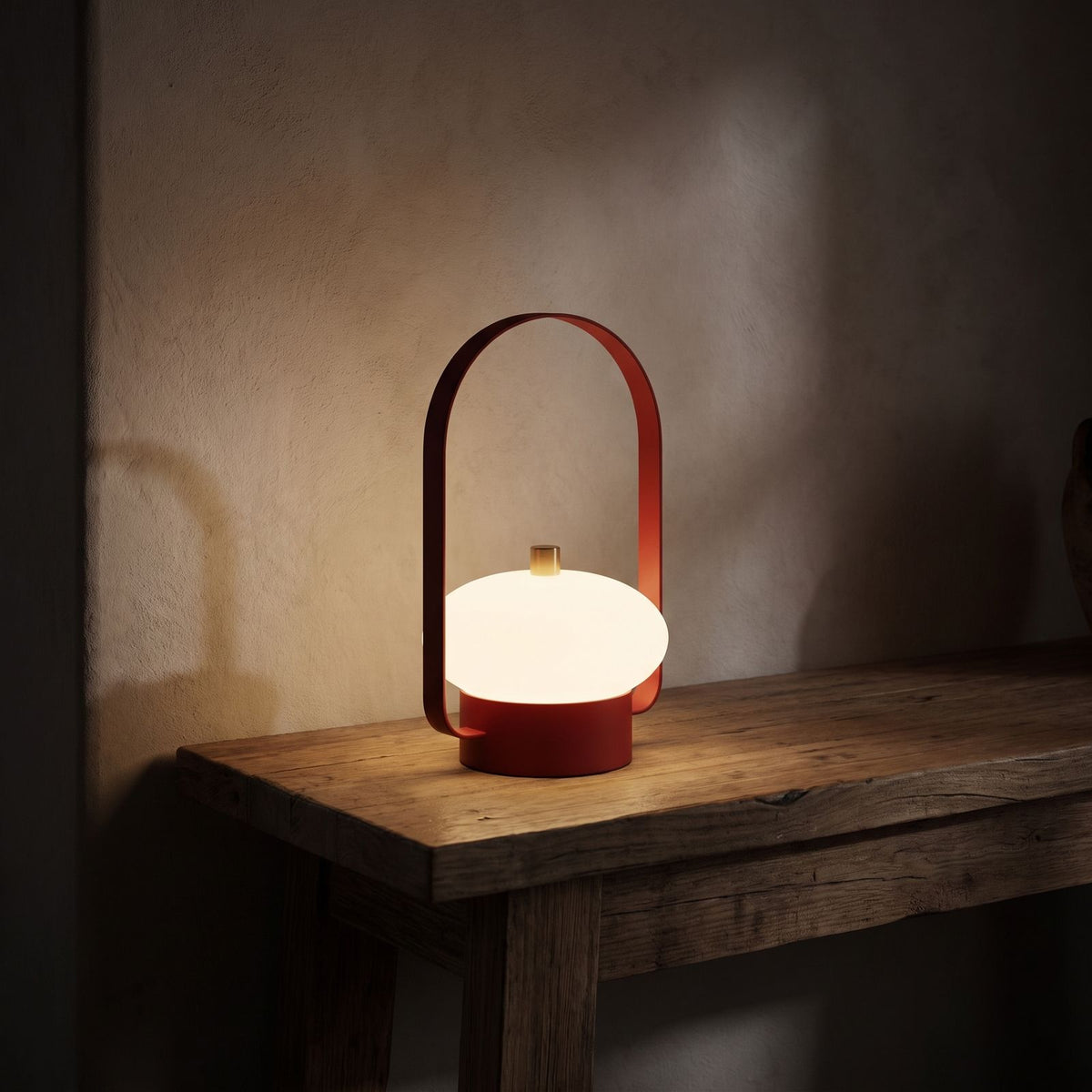 Mini Retro Portable Rechargeable Table Lamp glowing on a timber console at night