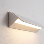 Minimalist White Metal Bar LED Wall Light, close view at 45 degrees on a plaster wall