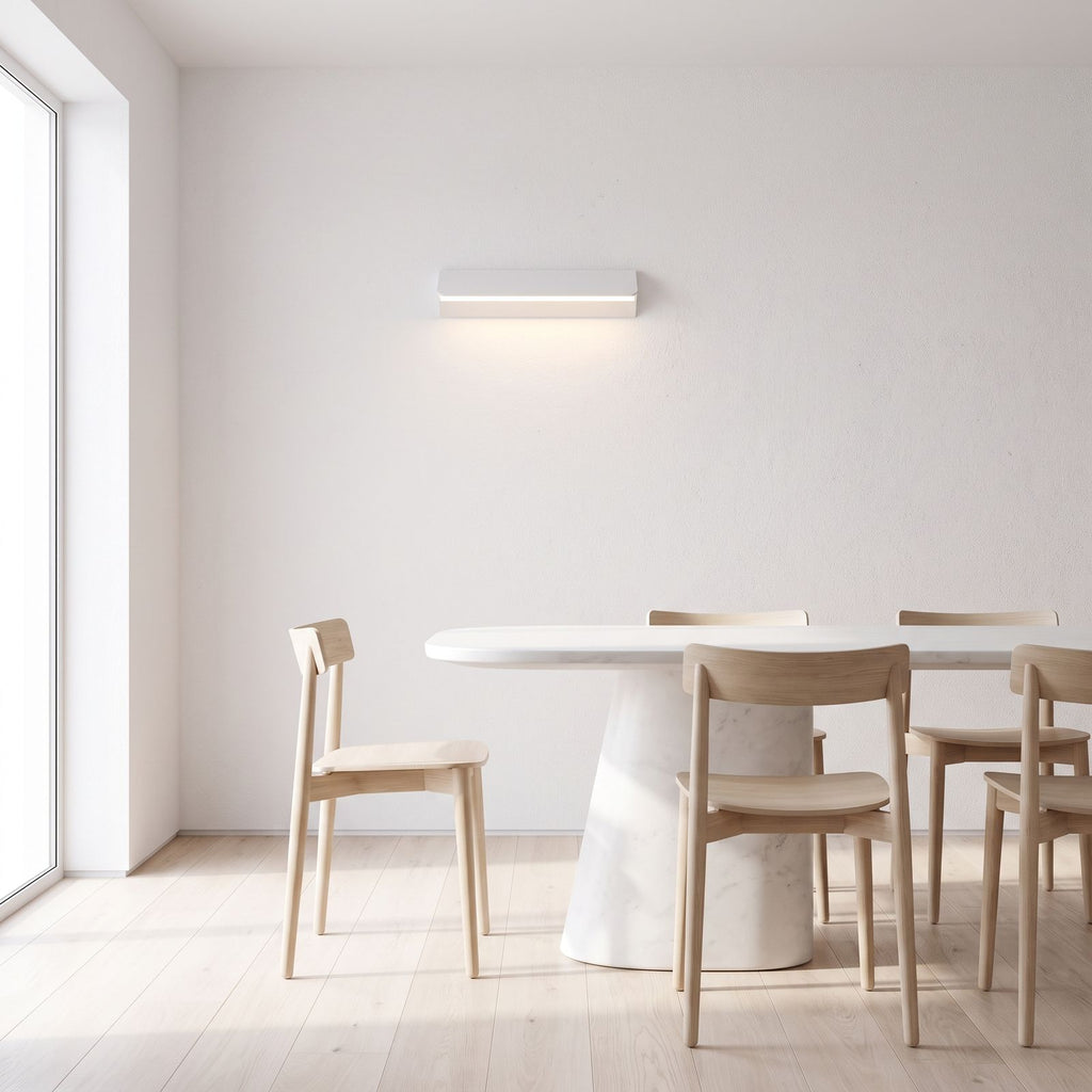 Minimalist White Metal Bar LED Wall Light on a dining room wall