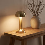 Gold mushroom dome table lamp on an entry console