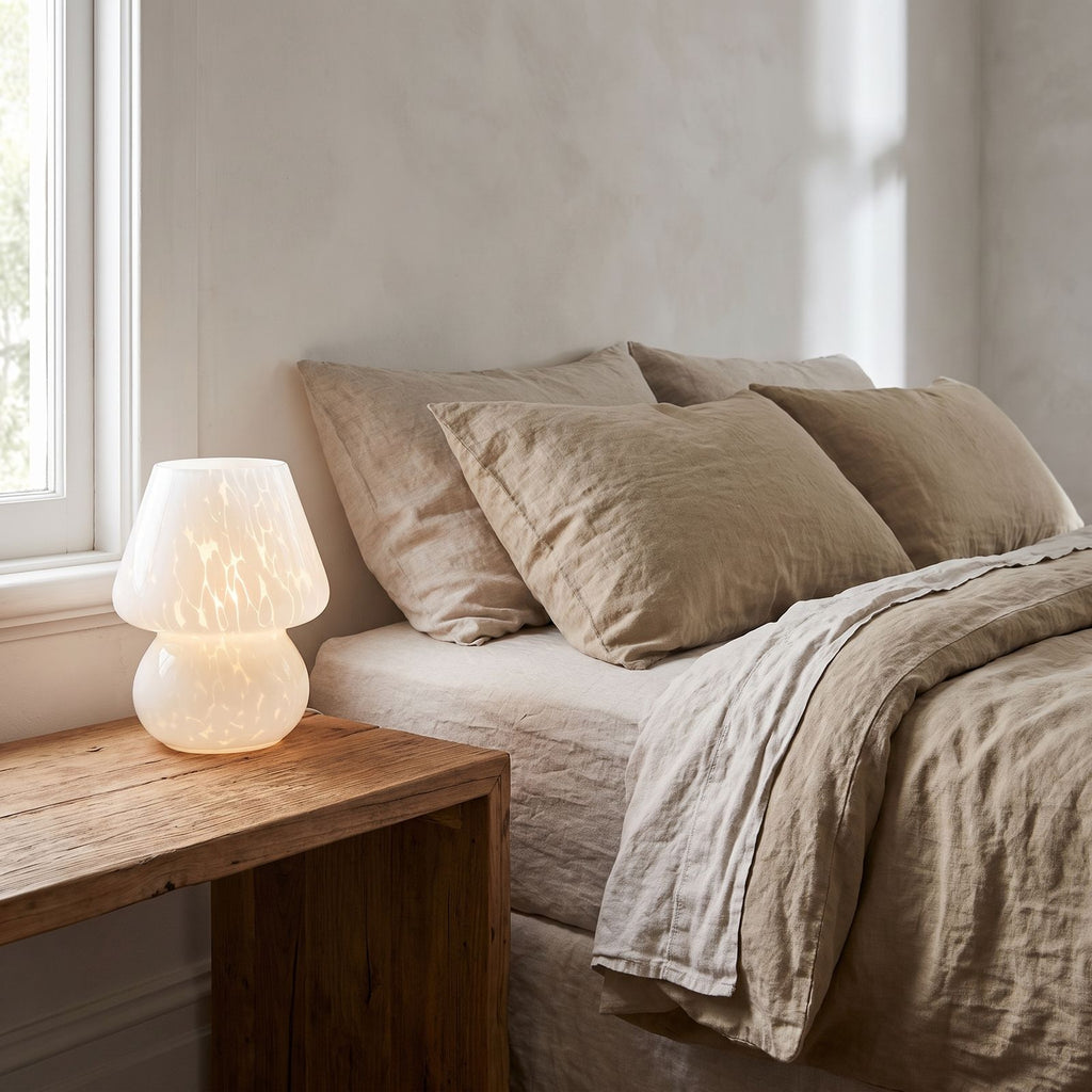Mushroom Glass Table Lamp on a bedside table