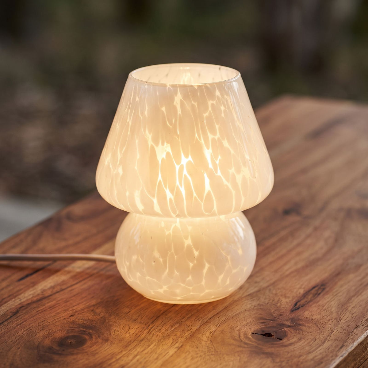 Mushroom Glass Table Lamp, close view on a timber surface
