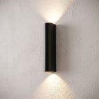 Narrow Aluminium Bar Up Down Wall Light, close view at 45 degrees on a plaster wall