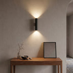Narrow Aluminium Bar Up Down Wall Light in a hallway above a timber console