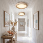 Two Natural Travertine LED Oyster Ceiling Lights, Ø40 cm, along the hallway ceiling of a coastal home