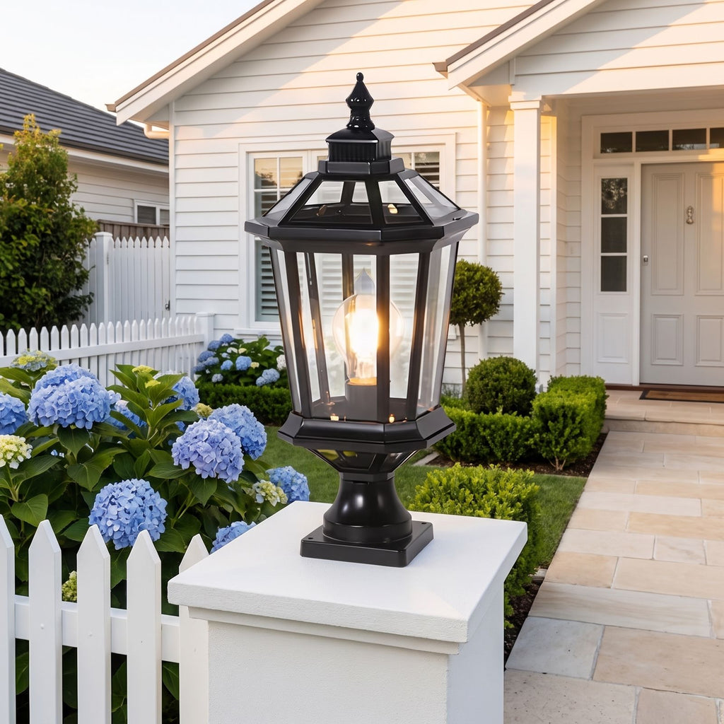 Octagonal Clear Glass Lantern Pillar Light on a gate pillar at the front entrance at golden hour