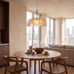 Open Petal Fabric Flower Pendant Light above a round table in a city apartment