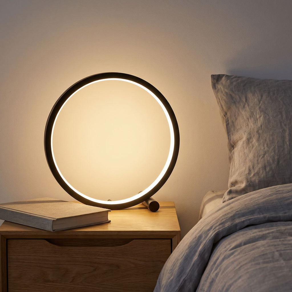 Open Ring LED Touch Dimming Table Lamp on a bedside table