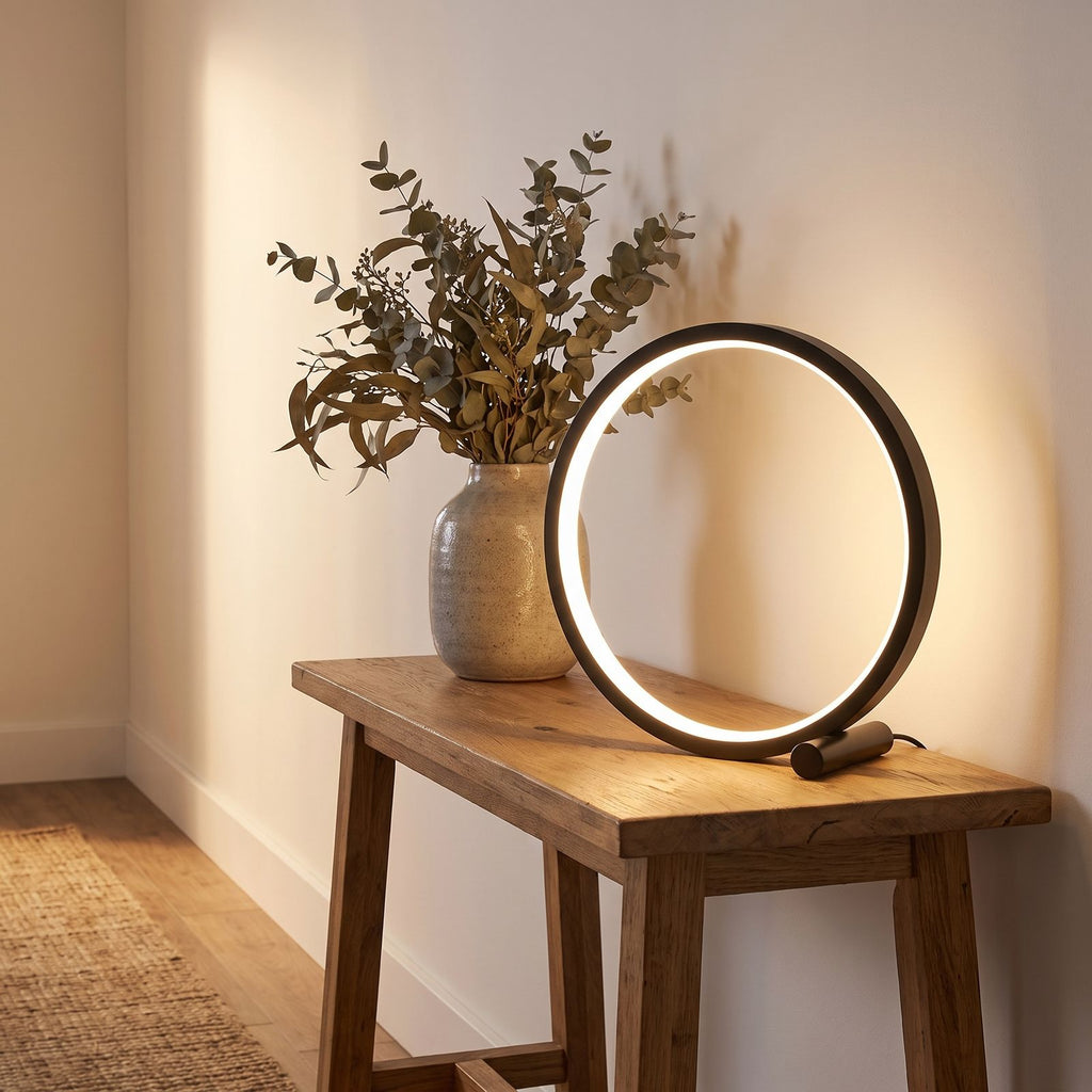 Black open ring table lamp on an entry console