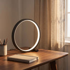 Black open ring table lamp on a home office desk