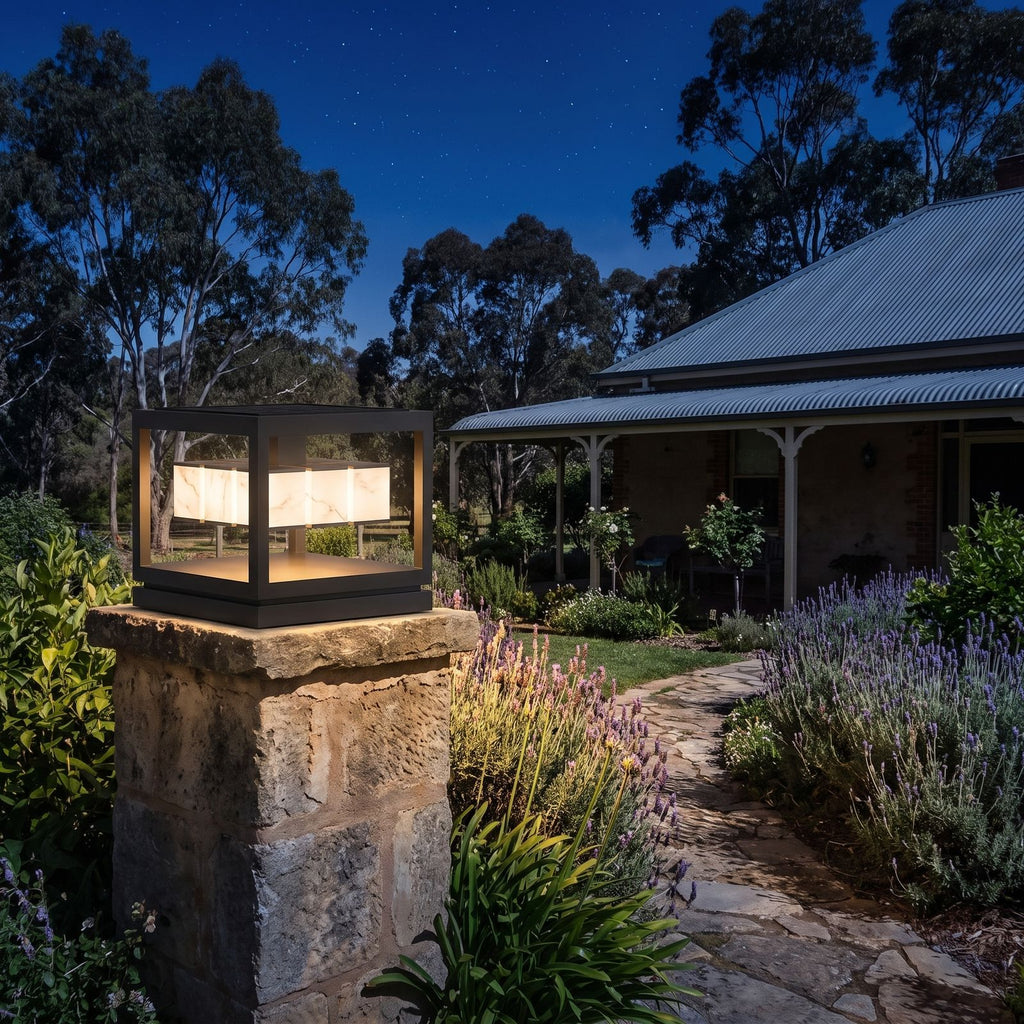Open Square Frame Stainless Steel Deck Post Light on a garden wall pillar at night