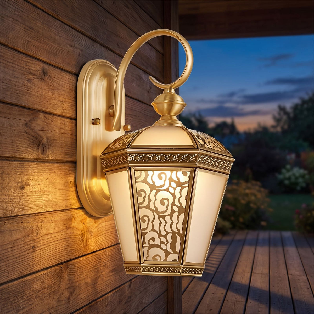 Ornate Brass and Glass Outdoor Wall Light on a porch wall at dusk