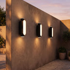 Oval Up Down Acrylic Outdoor Wall Light in a pair on the facade of an Australian home