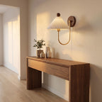 Pleated Ceramic Shade Bedside Wall Light in a hallway above a timber console