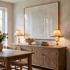 Two Scalloped Pleated Shade Bobbin Table Lamps at each end of a sideboard in a dining room