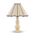 Scalloped Pleated Shade Bobbin Table Lamp in cream with black trim on a white background