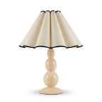 Scalloped Pleated Shade Bobbin Table Lamp in cream with black trim on a white background