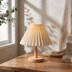 Pleated Shade Solid Wood Bedside Table Lamp, close view on a timber surface