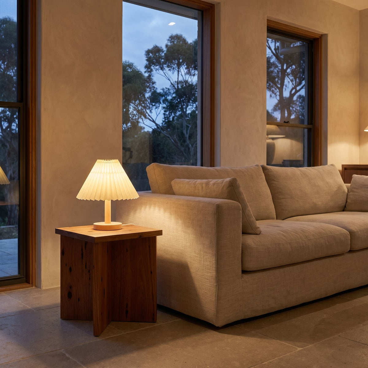 Pleated Shade Solid Wood Bedside Table Lamp on a side table beside a sofa