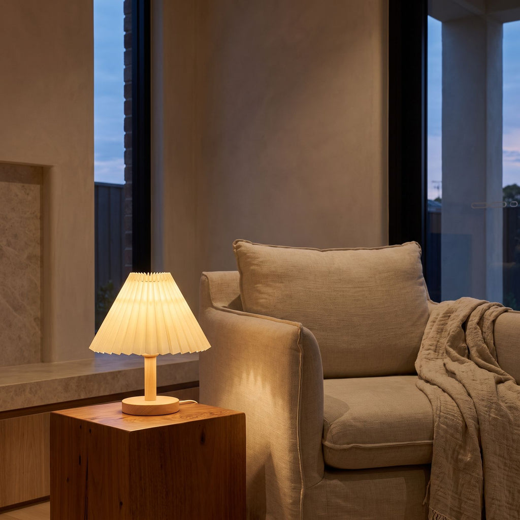 Pleated Shade Solid Wood Bedside Table Lamp beside a reading armchair