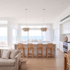Two Pleated Wave Linen LED Pendant Lights, Ø40 cm, above a marble kitchen island in a coastal home